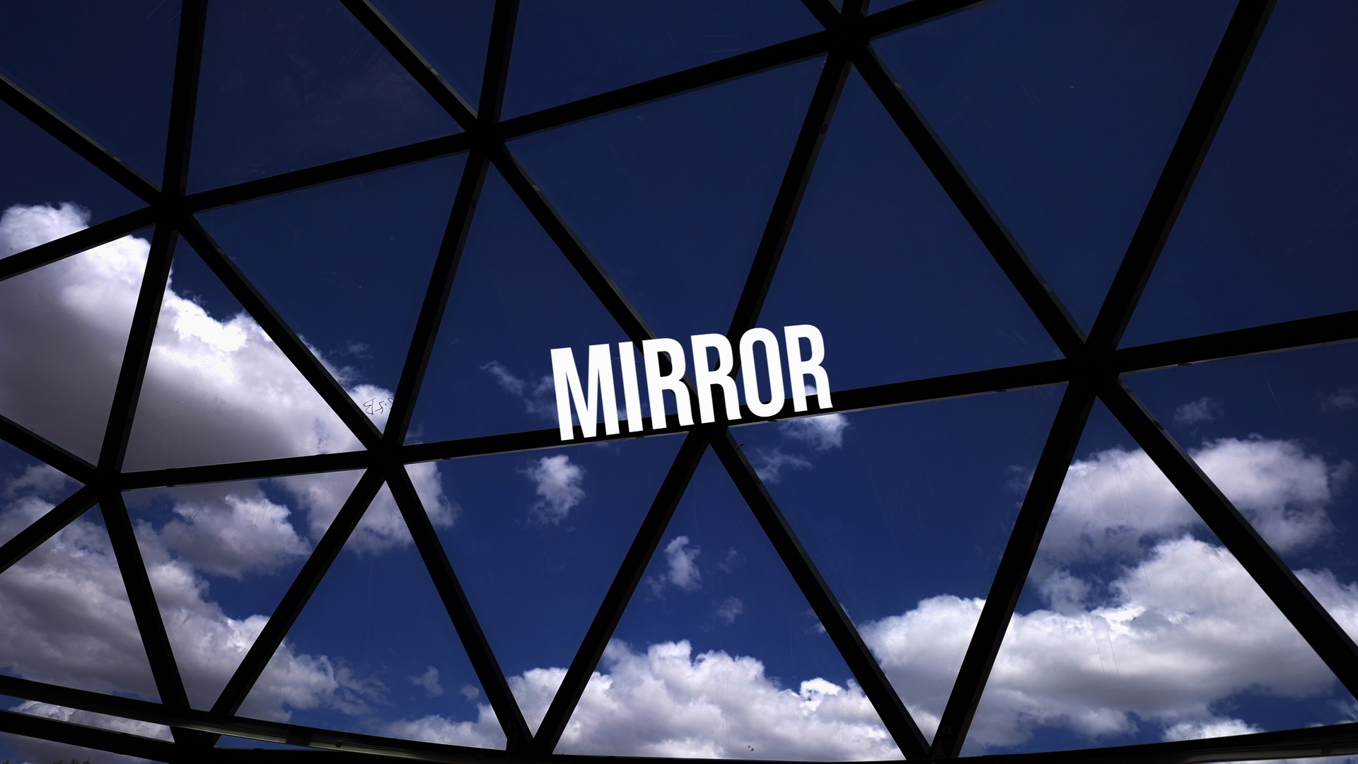 Mirror glass panels on a geodesic dome